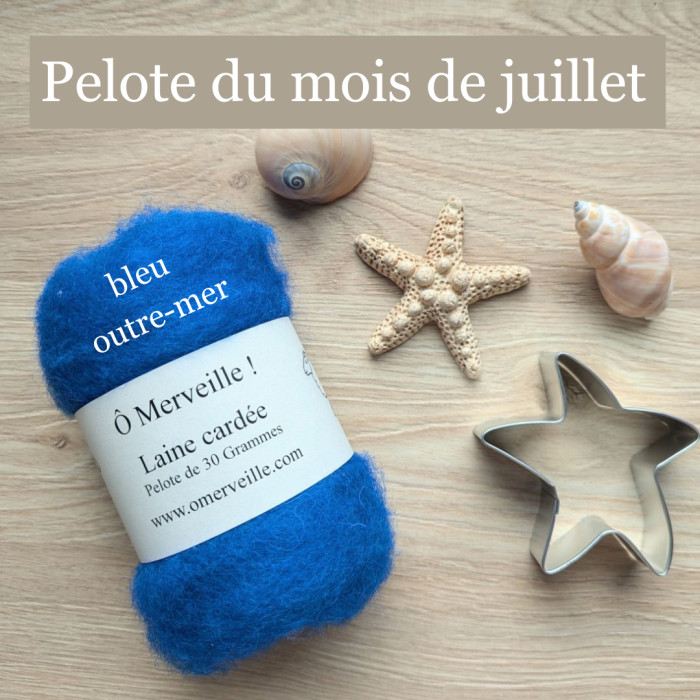 The ball of carded wool for the month of July: Overseas blue